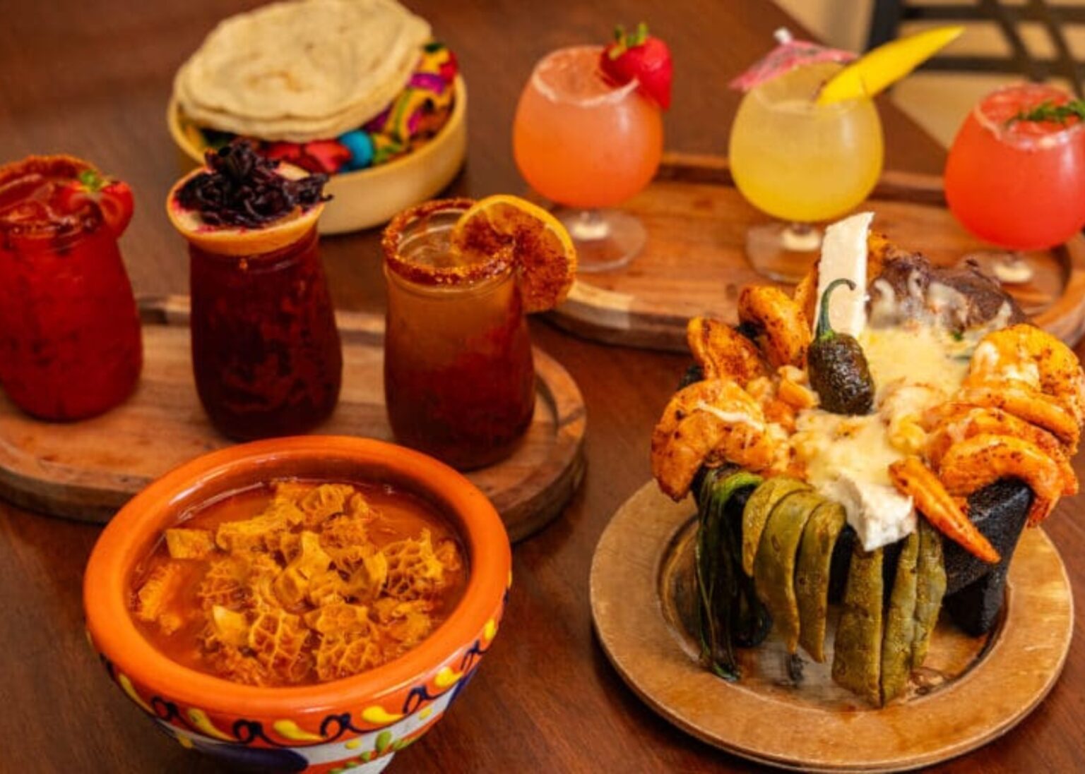 Colorful Mexican feast with cocktails and traditional dishes